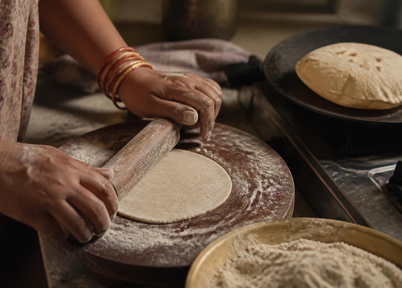 Rolling roti dough in an Indian kitchen